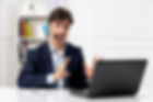 customer-service-handsome-guy-with-headset-laptop-suit-having-serious-videocall.jpg
