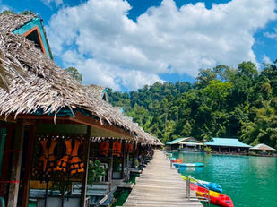 Floating accommodation at Praiwan Rafthouse surrounded by rainforest