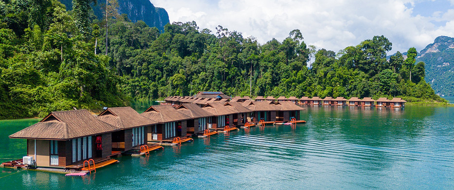 Floating villas at Laguna Chiew Larn surrounded by rainforest scenery on Cheow Lan Lake in Khao Sok National Park
