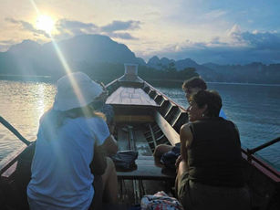 Sunrise boat ride with mist on Cheow Lan Lake