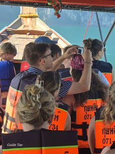 Guests boarding a longtail boat for their Cheow Lan Lake tour