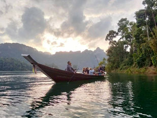 Sunrise boat ride on Cheow Lan Lake near Praiwan Rafthouse