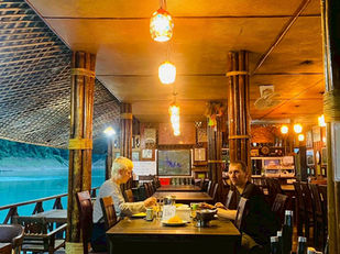 Guests having dinner at Praiwan Rafthouse