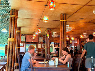 Guests having lunch at Praiwan Rafthouse on Cheow Lan Lake
