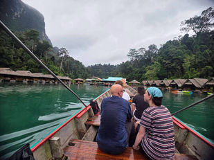Guests travelling deeper into Cheow Lan Lake by longtail boat