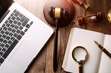 business-lawyers-discussing-contract-papers-with-brass-scale-desk-office-law-legal-service