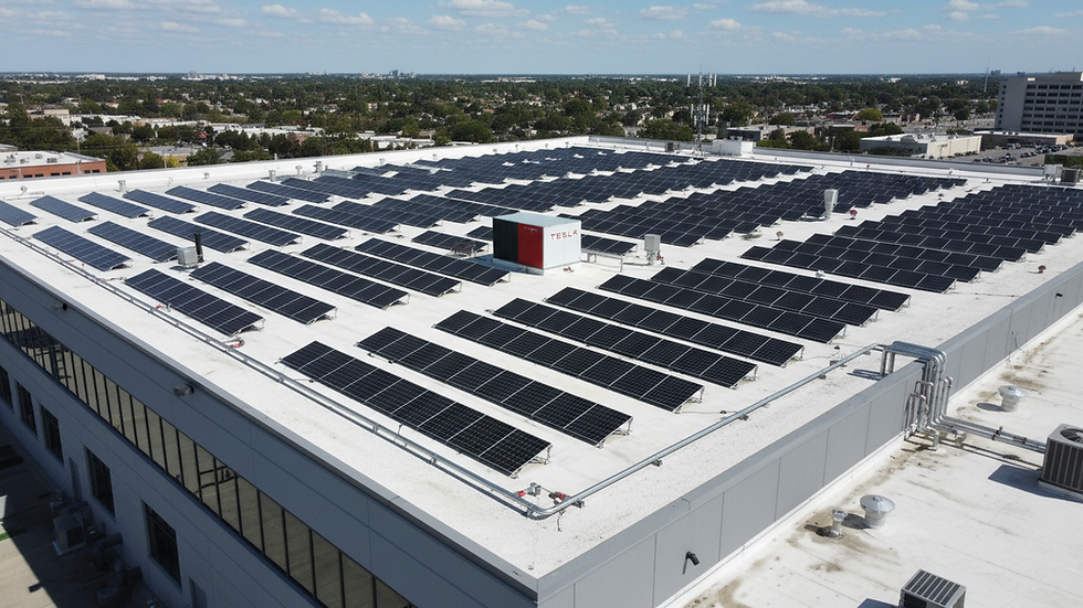 High angle view of solar panel installation on a commercial building roof