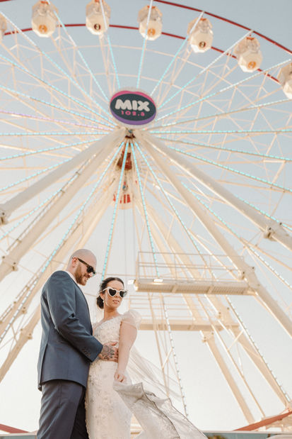 Bride and groom at funfair