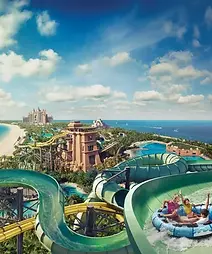 Aquaventure-Lifestyle-WaterparkHeroFamilyRideOverlookingResort.webp