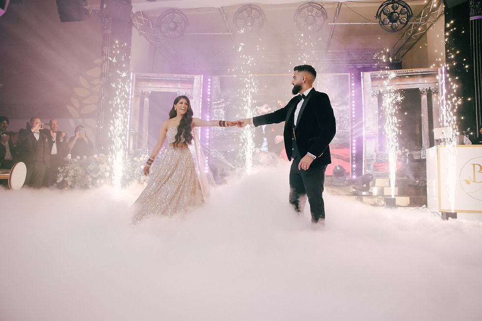 Indian wedding couple consulting with their DJ, customising their bespoke wedding playlist