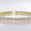 Thumbnail: White CZ Bangle Bracelet in Goldtone