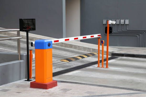 Eye-level view of a well-managed parking area with a functioning barrier gate system