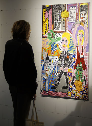 A photo of a person standing in front of the painting