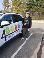 man standing besides a driving training car