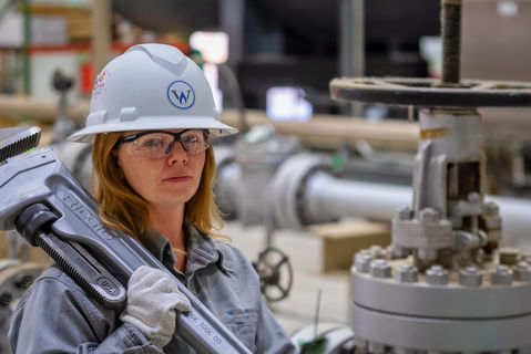 Woman worker, oil and gas field.
