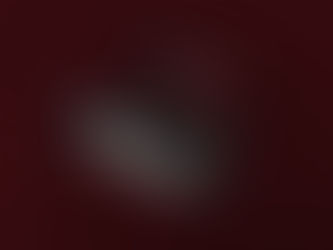 Responsive website design displayed on a laptop, tablet, and smartphone, showcasing a modern IT and technology solutions interface with a dark red background.