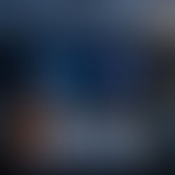 Cybersecurity strategy meeting, with a large display screen showing data protection graphics, padlocks, charts, and shield icons—representing IT security planning and compliance discussions.   