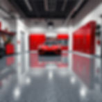 Luxury residential garage with glossy epoxy-coated floor in gray with decorative flakes. B