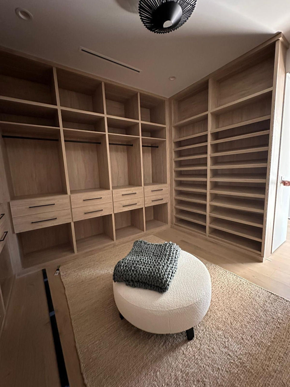 Custom walk-in closets designed for luxury and functionality.