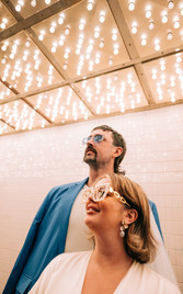 las vegas elopement photographer brazen honey films captures wedding at little white chapel with elvis officiant. Colorful wedding photos in downtown las vegas with neon lights 