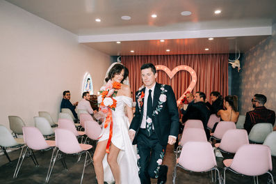 Las Vegas wedding photographer brazen honey films captures an epic elopement at sure thing chapel with elvis officiant. Photoshoot at the neon museum and downtown las vegas with neon lights.