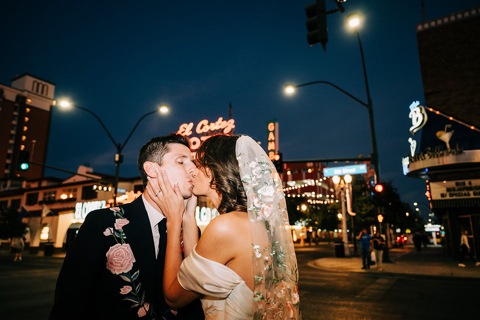 Las Vegas wedding photographer brazen honey films captures an epic elopement at sure thing chapel with elvis officiant. Photoshoot at the neon museum and downtown las vegas with neon lights.