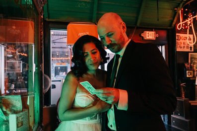 bride and groom pose for photos at a dive bar in las vegas captured by las vegas elopement photographer brazen honey films