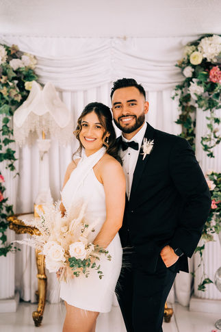 Bride and groom pose for wedding portraits after their vegas elopement at the little white wedding chapel. Captured by las Vegas elopement photographer brazen honey films.