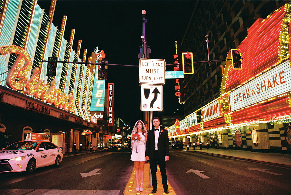 Las Vegas elopement film photographer brazen honey captures vintage inspired elopement at the little white wedding chapel. Wedding photos captured on 35mm film in downtown vegas under the neon lights.