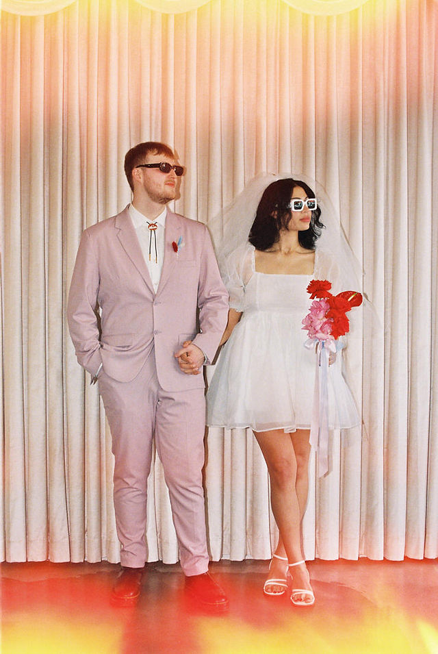 Las vegas elopement film photographer captures weddings on 35mm film. Vegas kitsch wedding vibes at the sure thing chapel. Analog photobooth in downtown las vegas.