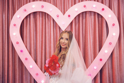 35mm film photo by las vegas elopement photographer brazen honey films. couple gets married at sure thing chapel with pink vintage vibes.