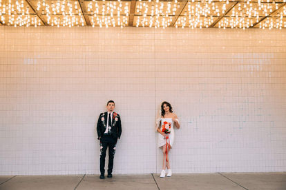 Las Vegas wedding photographer brazen honey films captures an epic elopement at sure thing chapel with elvis officiant. Photoshoot at the neon museum and downtown las vegas with neon lights.