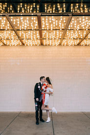 Las Vegas wedding photographer brazen honey films captures an epic elopement at sure thing chapel with elvis officiant. Photoshoot at the neon museum and downtown las vegas with neon lights.