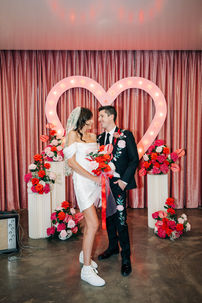 Las Vegas wedding photographer brazen honey films captures an epic elopement at sure thing chapel with elvis officiant. Photoshoot at the neon museum and downtown las vegas with neon lights.