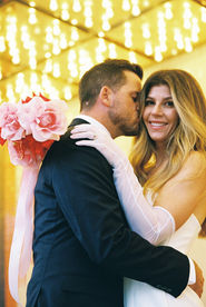 Las Vegas Vow Renewal at the Little White wedding chapel captured on 35mm film by elopement photographers brazen honey films. Downtown Vegas neon lights elopement photos. Kitsch wedding inspiration