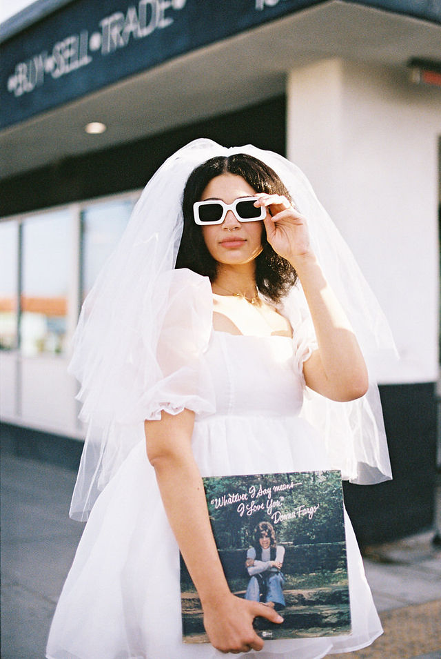 Las vegas elopement film photographer captures weddings on 35mm film. Vegas kitsch wedding vibes at the sure thing chapel. Analog photobooth in downtown las vegas.