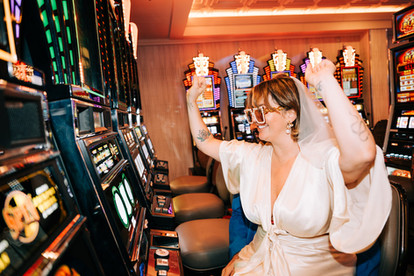 las vegas elopement photographer brazen honey films captures wedding at little white chapel with elvis officiant. Colorful wedding photos in downtown las vegas with neon lights 