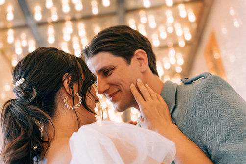 Bride and groom take wedding portraits in downtown las vegas under the neon lights. Captured by las vegas elopement photographer brazen honey films