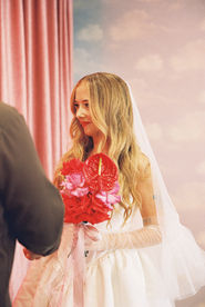 35mm film photo by las vegas elopement photographer brazen honey films. couple gets married at sure thing chapel with pink vintage vibes.