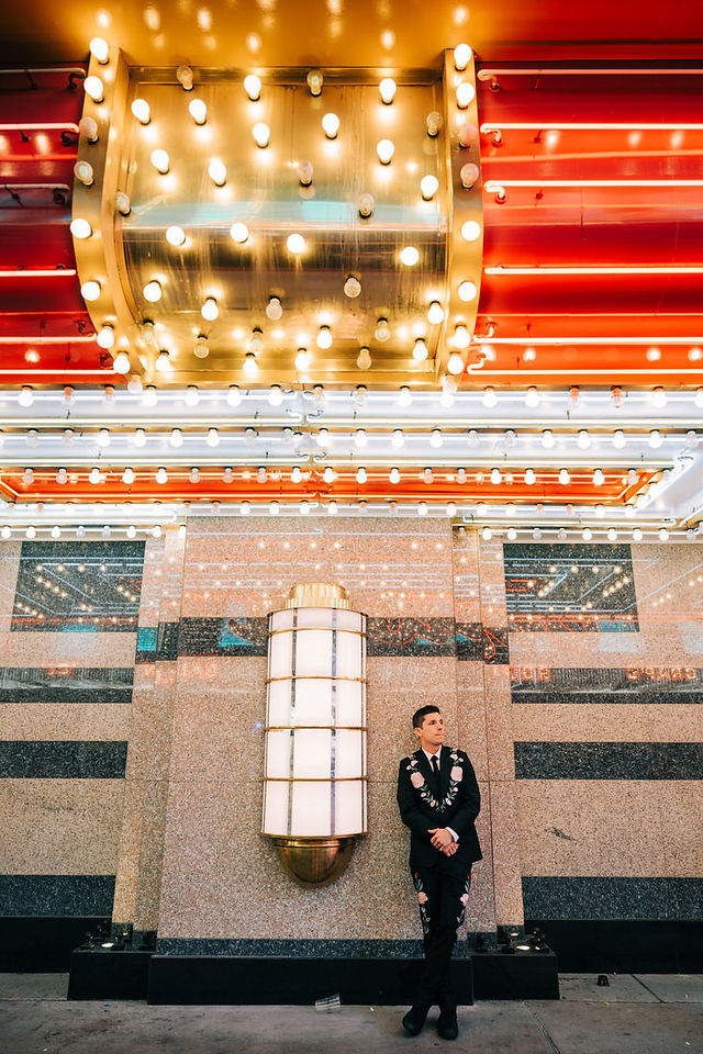 Las Vegas wedding photographer brazen honey films captures an epic elopement at sure thing chapel with elvis officiant. Photoshoot at the neon museum and downtown las vegas with neon lights.