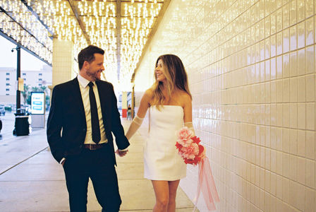 Las Vegas Vow Renewal at the Little White wedding chapel captured on 35mm film by elopement photographers brazen honey films. Downtown Vegas neon lights elopement photos. Kitsch wedding inspiration