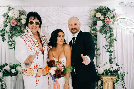 bride and groom recite wedding vows at the little white wedding chapel in las vegas. elvis wedding officiant captured by las vegas elopement photographer brazen honey films