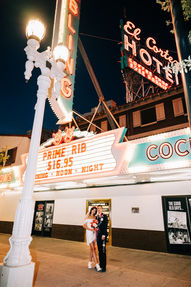 Las Vegas wedding photographer brazen honey films captures an epic elopement at sure thing chapel with elvis officiant. Photoshoot at the neon museum and downtown las vegas with neon lights.