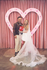 35mm film photo by las vegas elopement photographer brazen honey films. couple gets married at sure thing chapel with pink vintage vibes.