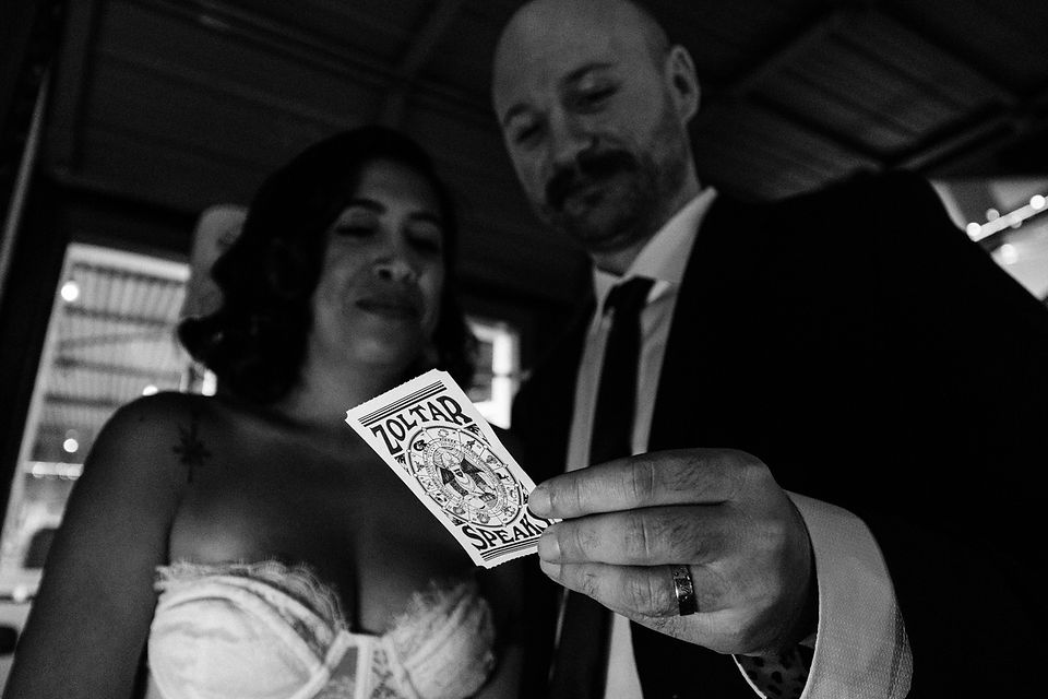 bride and groom pose for photos at a dive bar in las vegas captured by las vegas elopement photographer brazen honey films