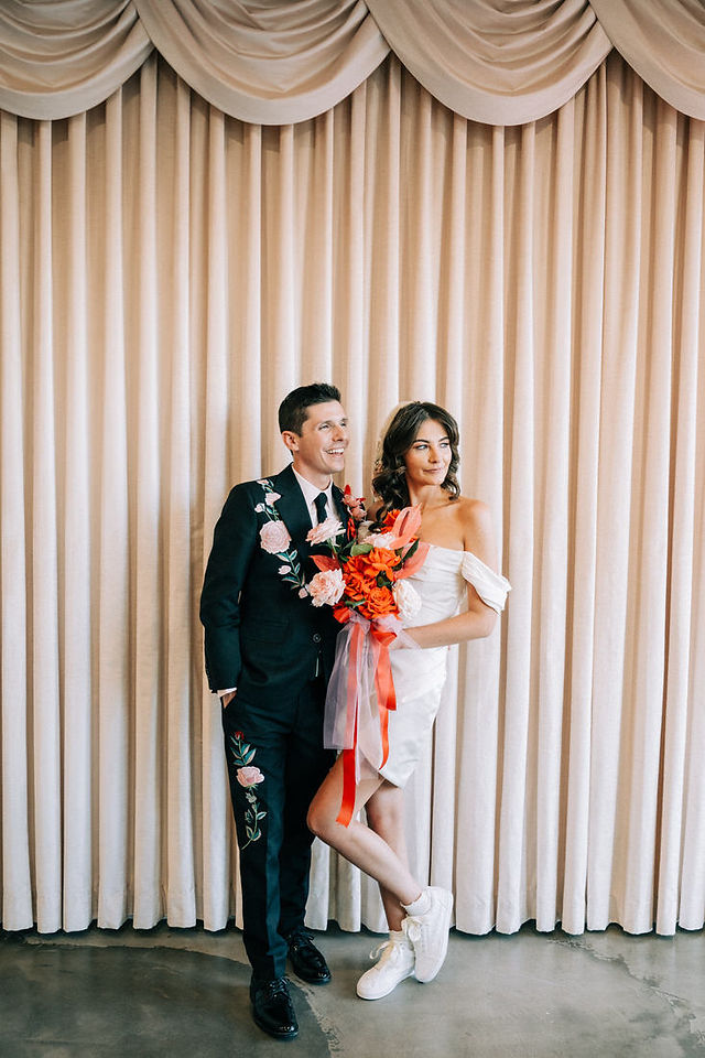 Las Vegas wedding photographer brazen honey films captures an epic elopement at sure thing chapel with elvis officiant. Photoshoot at the neon museum and downtown las vegas with neon lights.