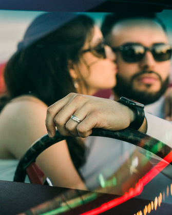 Bride and groom kiss in a classic convertible mustang on their wedding day. Where to take wedding pictures in Las Vegas. Captured by las Vegas elopement photographer brazen honey films.