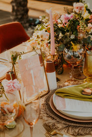 golden pink and orange intimate wedding reception table set up at the old polo estate in palm springs