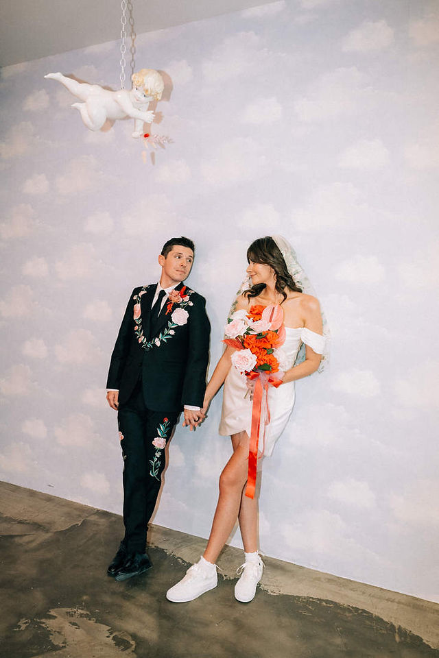 Las Vegas wedding photographer brazen honey films captures an epic elopement at sure thing chapel with elvis officiant. Photoshoot at the neon museum and downtown las vegas with neon lights.