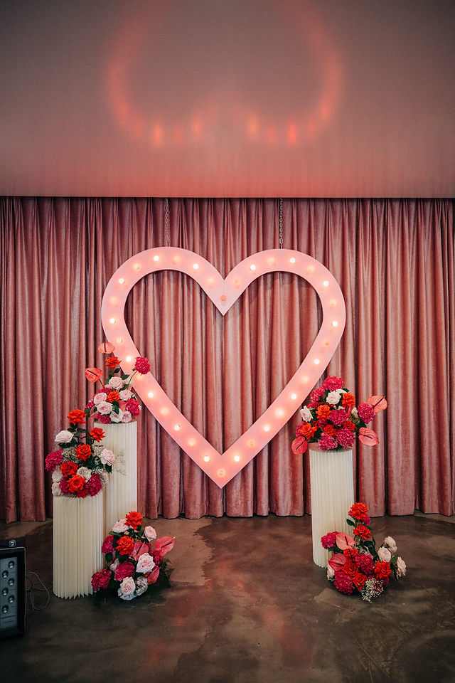 Las Vegas wedding photographer brazen honey films captures an epic elopement at sure thing chapel with elvis officiant. Photoshoot at the neon museum and downtown las vegas with neon lights.